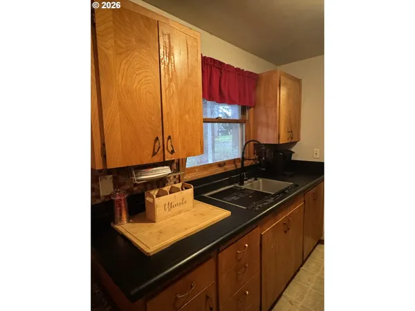 a kitchen with a sink and a stove