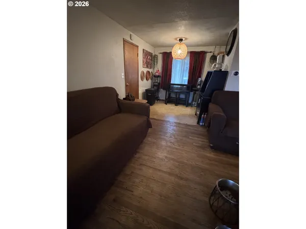 a living room with furniture and a gym