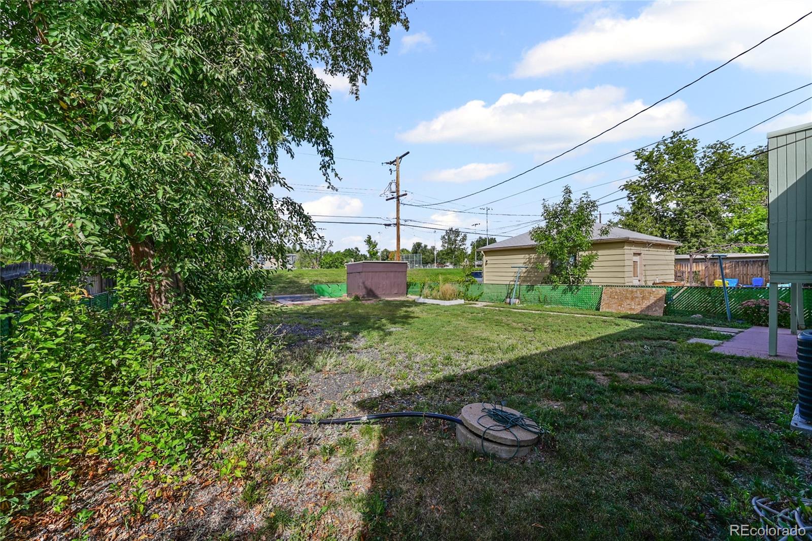 2245 Ames Street Edgewater, CO 80214 - Photo 11 of 21 a backyard of a house with lots of green space