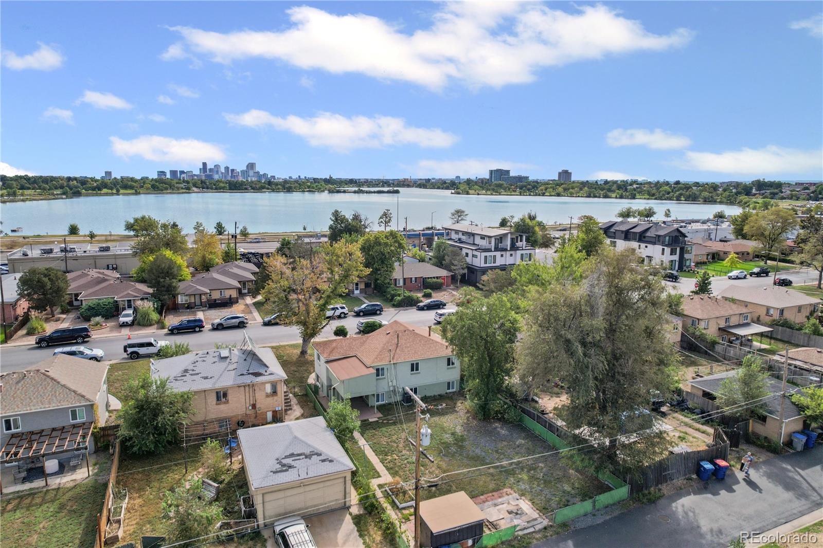 2245 Ames Street Edgewater, CO 80214 - Photo 8 of 21 an aerial view of a city with lots of residential buildings lake and ocean view