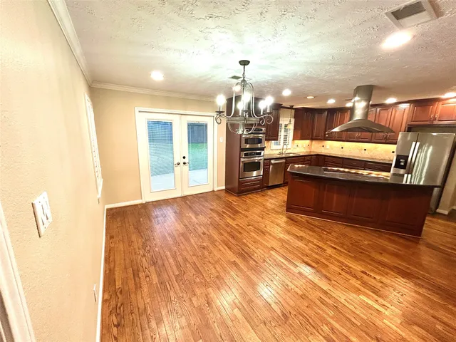 a view of gallery with wooden floor