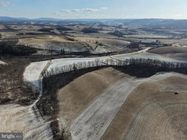 a view of an ocean beach and mountain