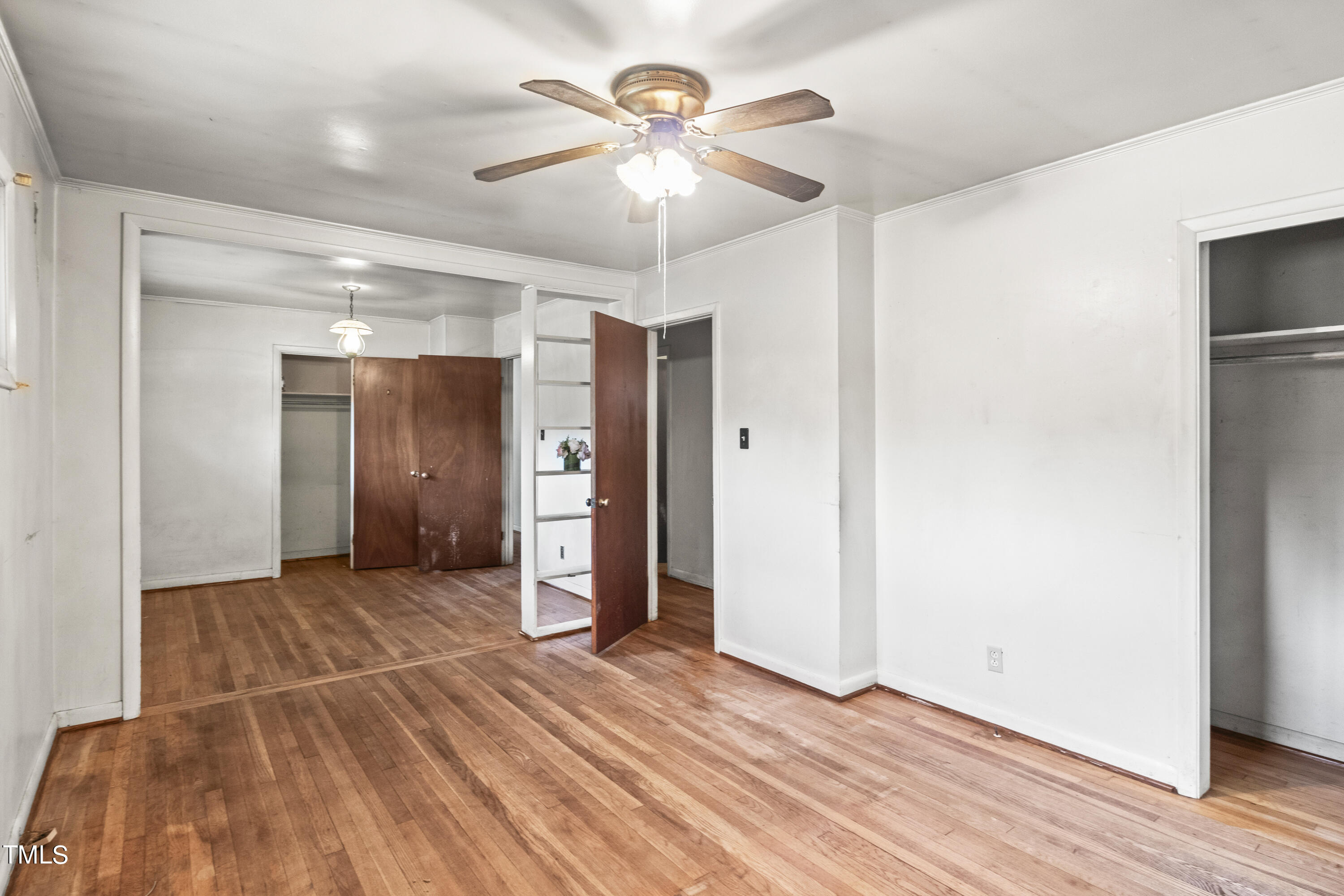 633 Ashford Street Raleigh, NC 27610 - Photo 17 of 25 a view of empty room with wooden floor