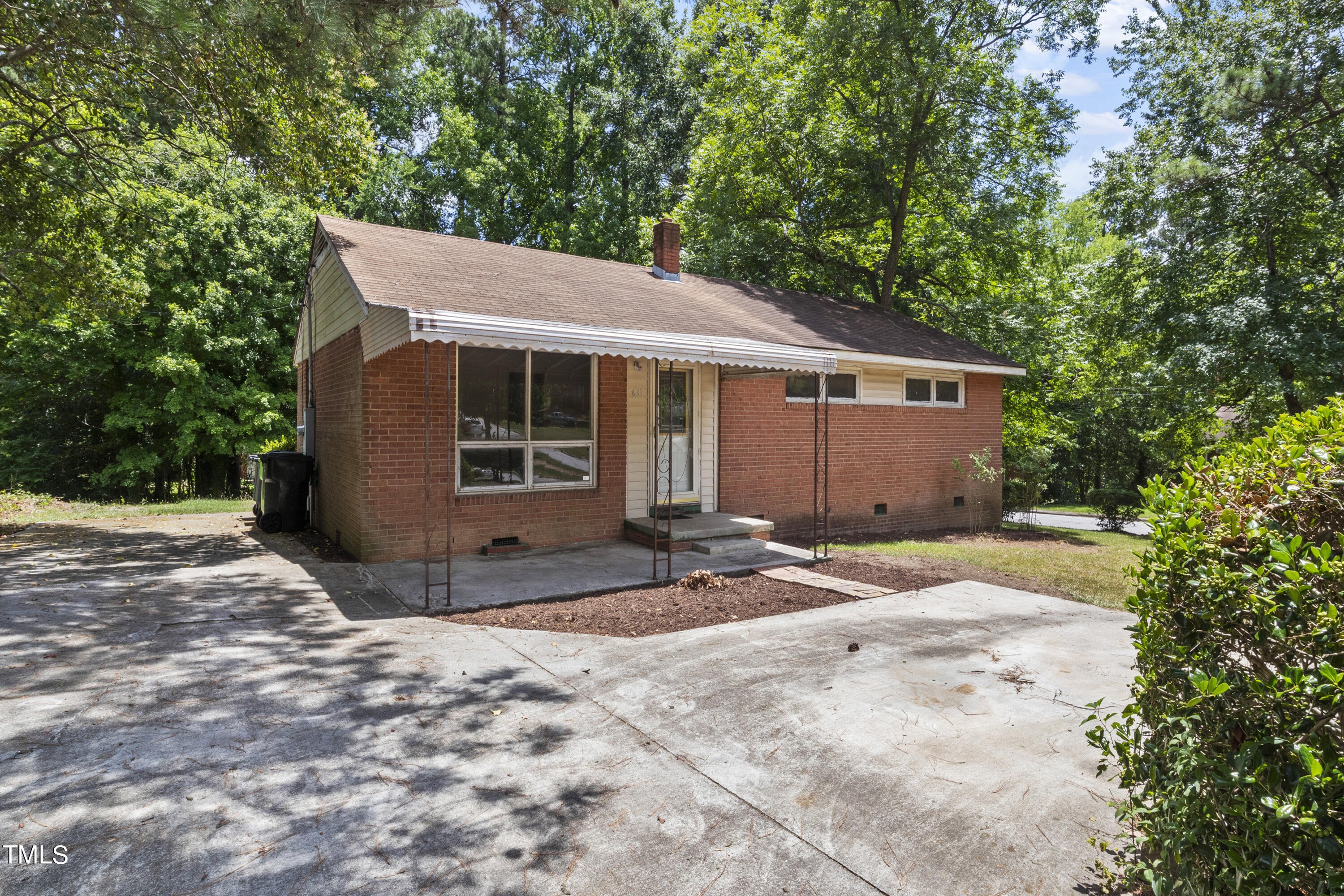 633 Ashford Street Raleigh, NC 27610 - Photo 2 of 25 a view of a house with a yard and large tree