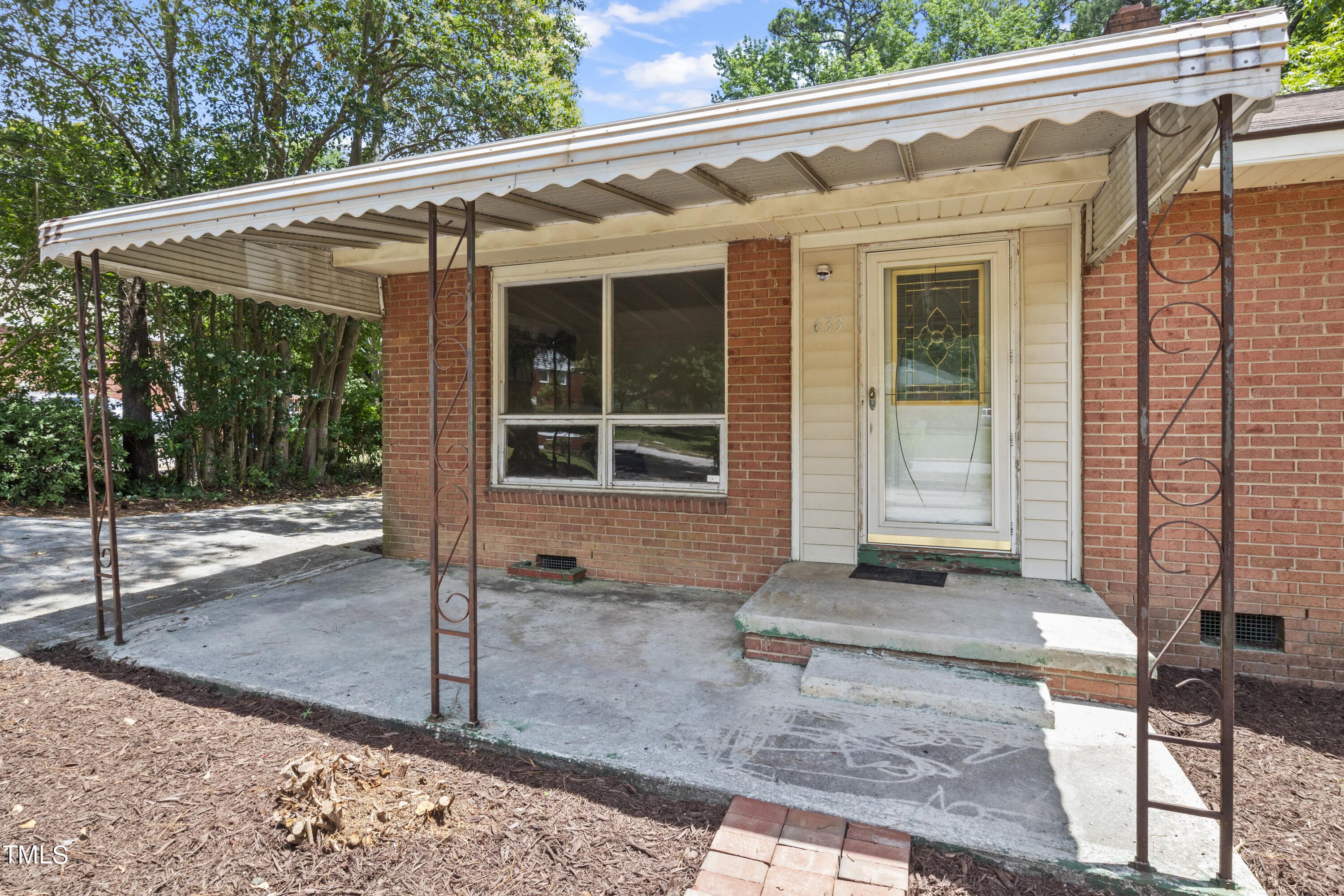 633 Ashford Street Raleigh, NC 27610 - Photo 4 of 25 a view of a house with a yard