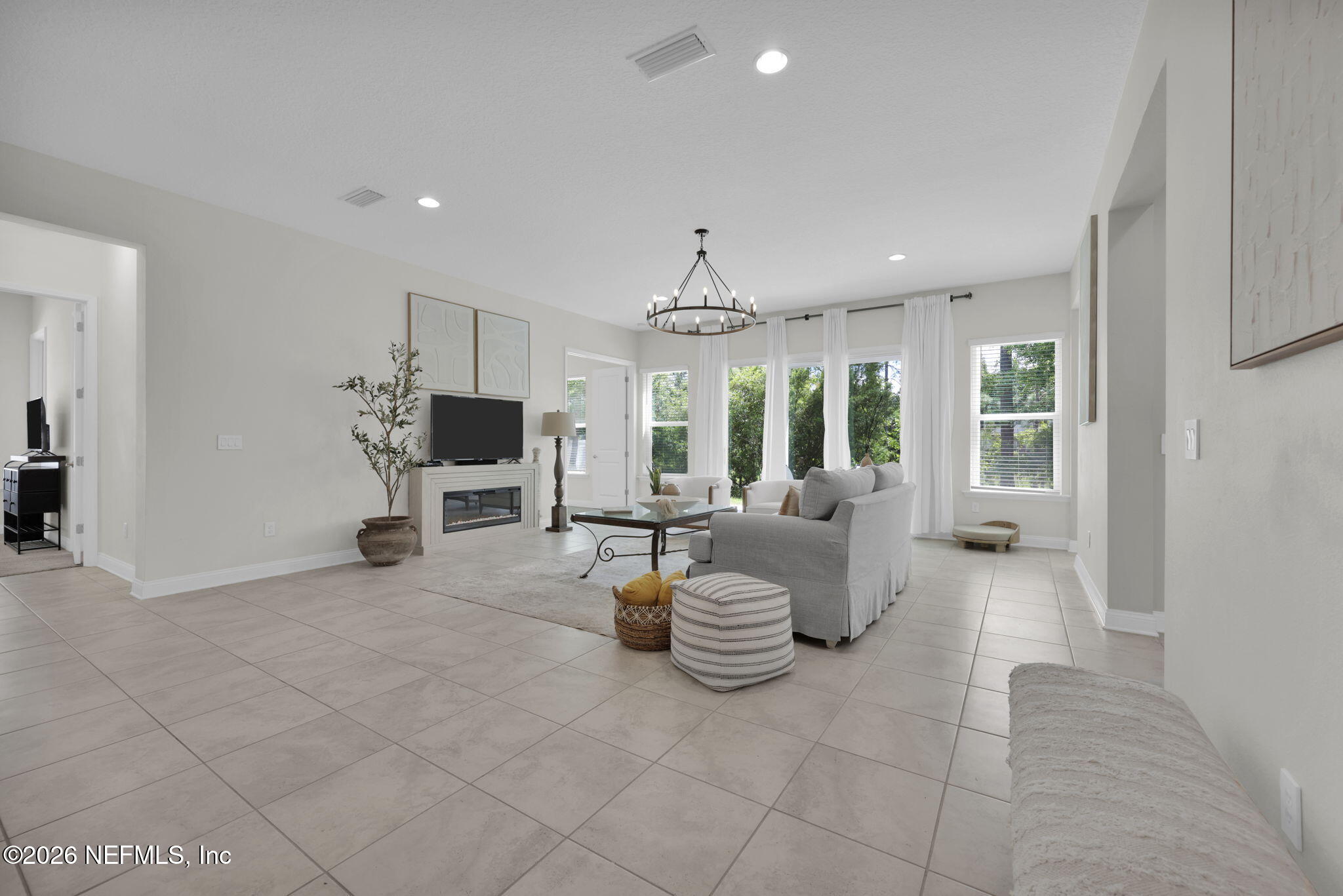 179 Conquistador Road St. Johns, FL 32259 - Photo 29 of 88 a living room with furniture and a flat screen tv