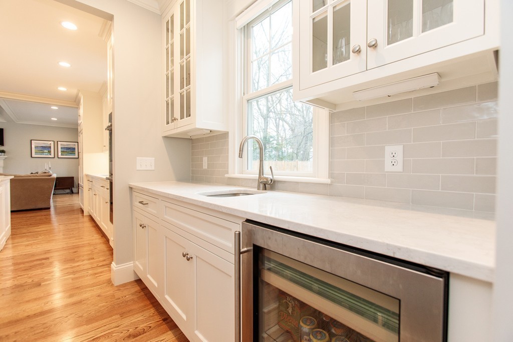 4 Ingersoll Road Wellesley, MA 02481 - Photo 8 of 26 a kitchen with stainless steel appliances cabinets a large window and wooden floor