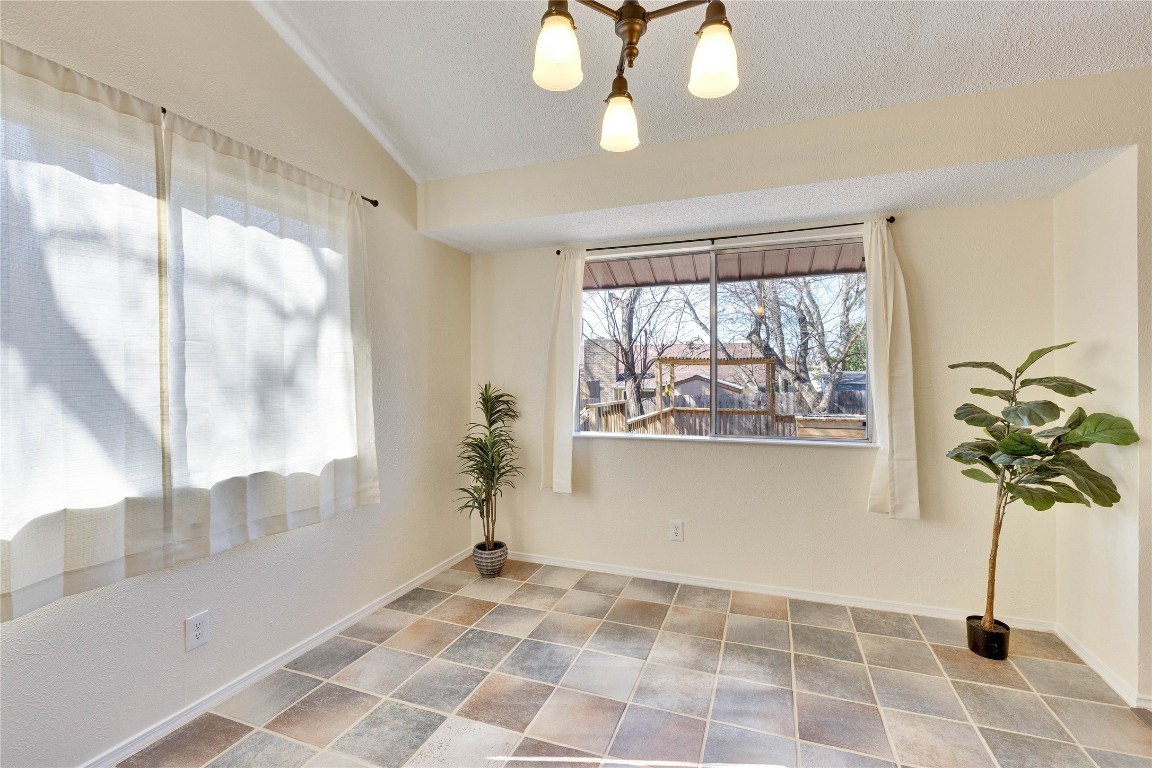 1002 Bodark Lane Austin, TX 78745 - Photo 13 of 35 a view of empty room with a window and a potted plant