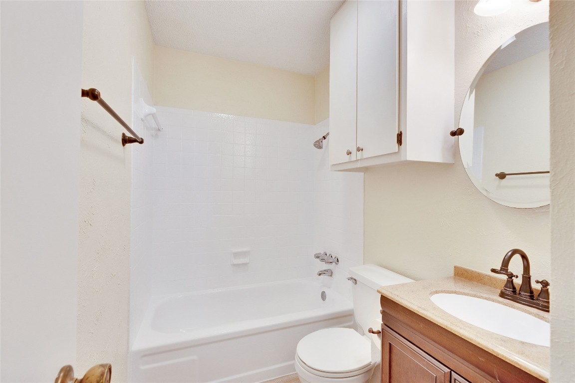 1002 Bodark Lane Austin, TX 78745 - Photo 27 of 35 a bathroom with a sink a toilet and bathtub