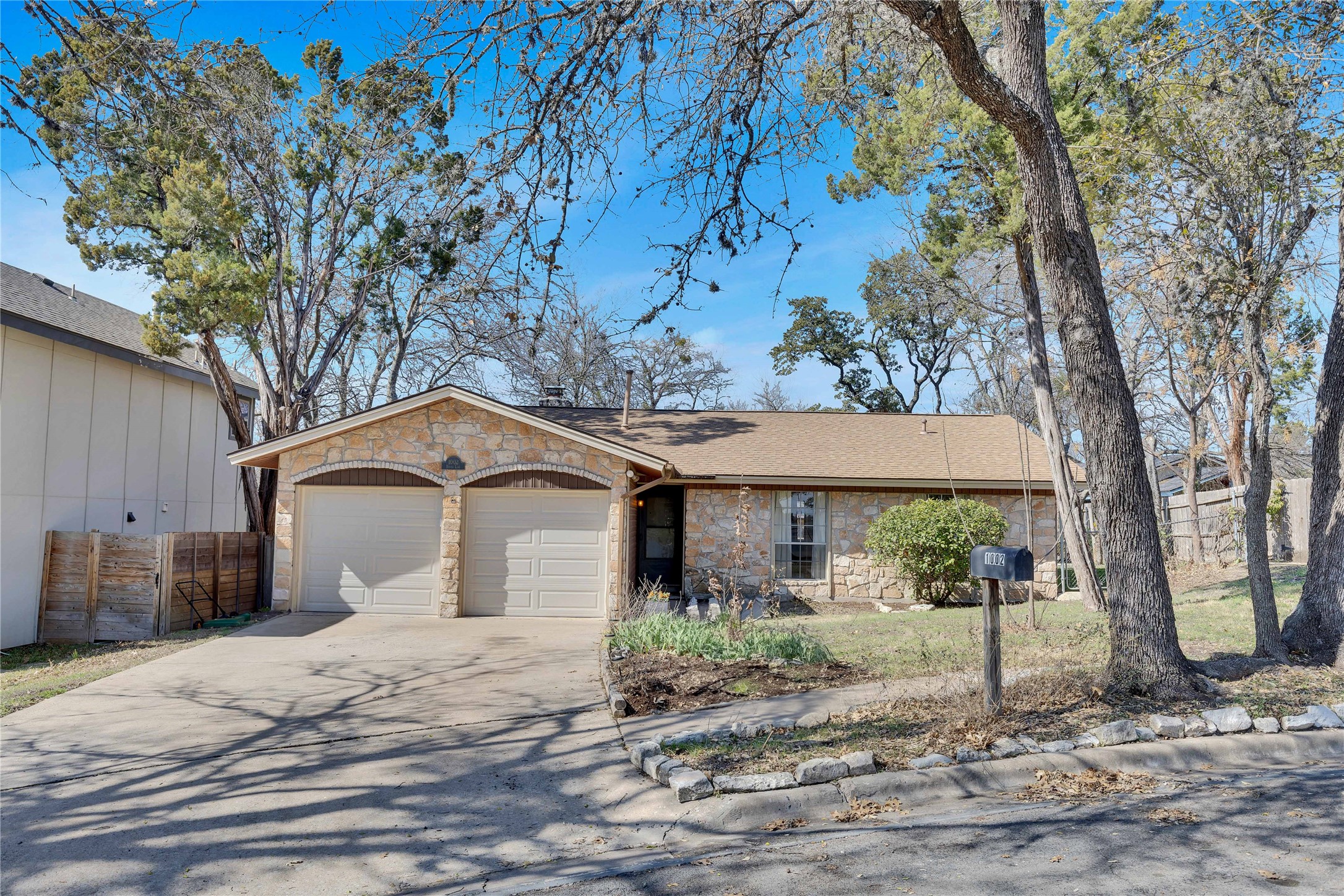 1002 Bodark Lane Austin, TX 78745 - Photo 34 of 35 a front view of a house with a garden