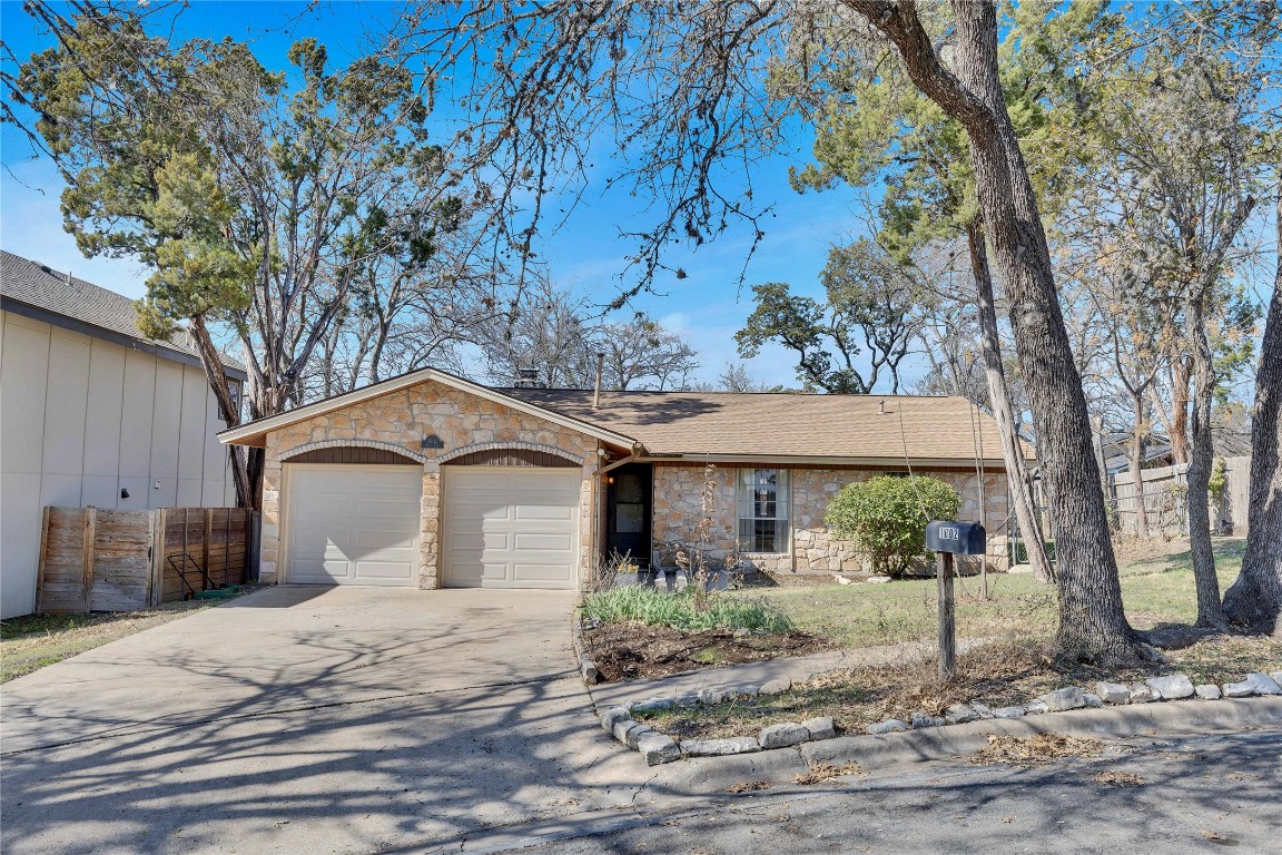 1002 Bodark Lane Austin, TX 78745 - Photo 34 of 35 a front view of a house with a garden