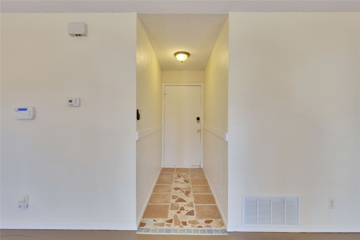 1002 Bodark Lane Austin, TX 78745 - Photo 3 of 35 a view of hallway with wooden floor