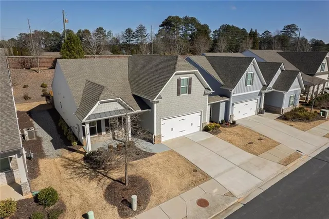 a view of a chairs and table in backyard