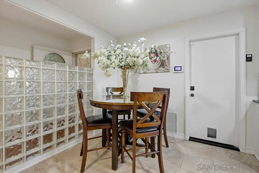 11038 Larkridge Street Santee, CA 92071 - Photo 9 of 44 a view of a dining room with furniture and chandelier