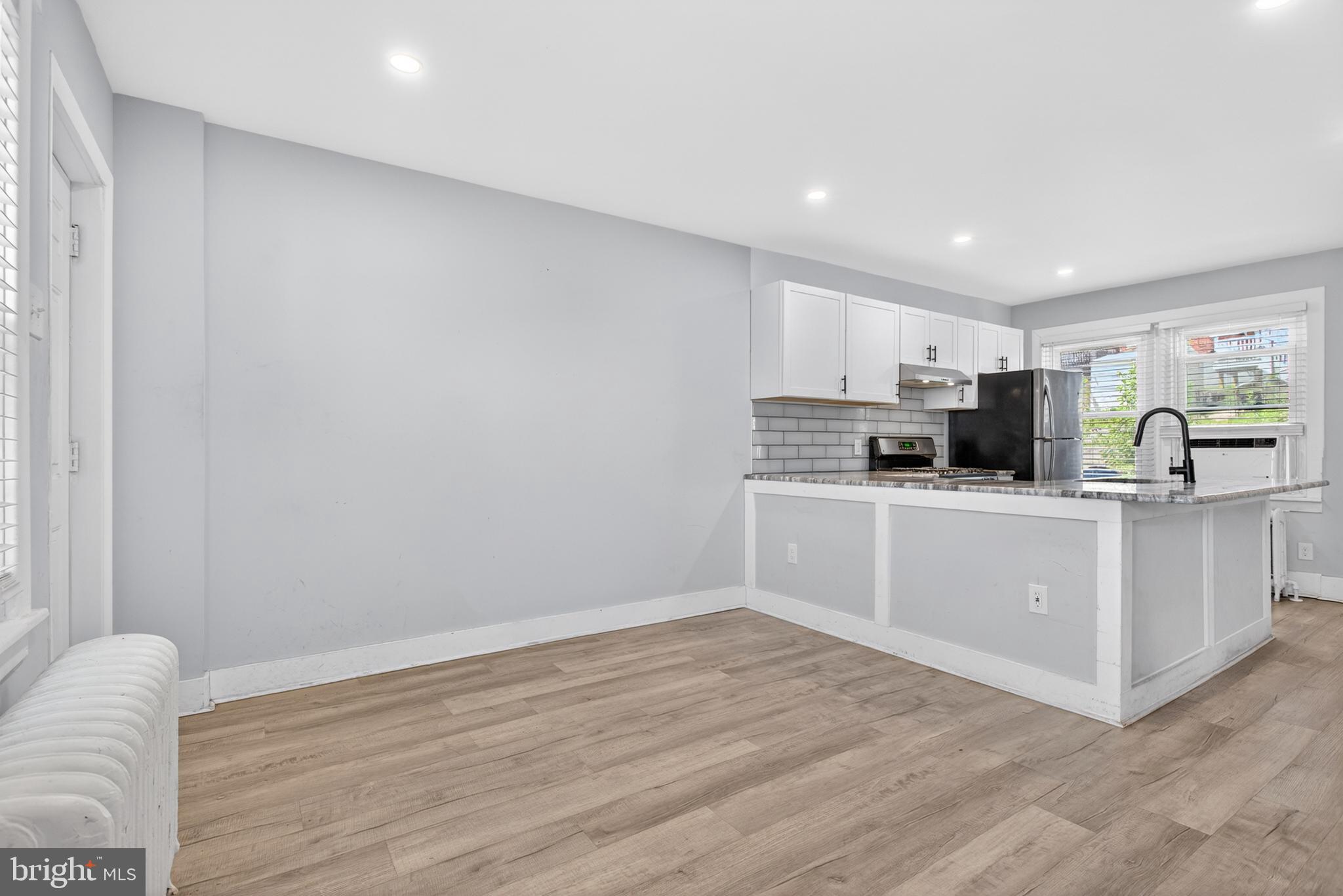1122 West Ridge Road Marcus Hook, PA 19061 - Photo 13 of 27 a kitchen with white cabinets and white appliances
