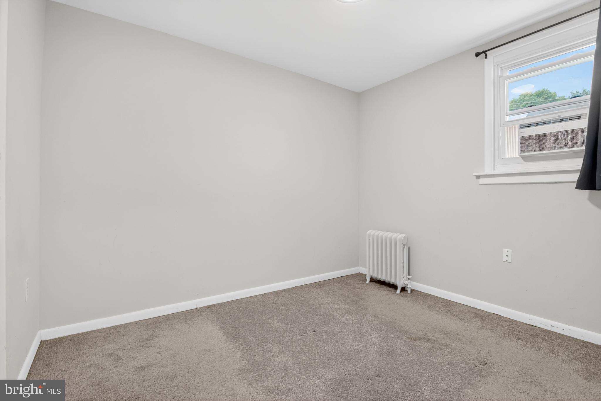 1122 West Ridge Road Marcus Hook, PA 19061 - Photo 19 of 27 an empty room with a window