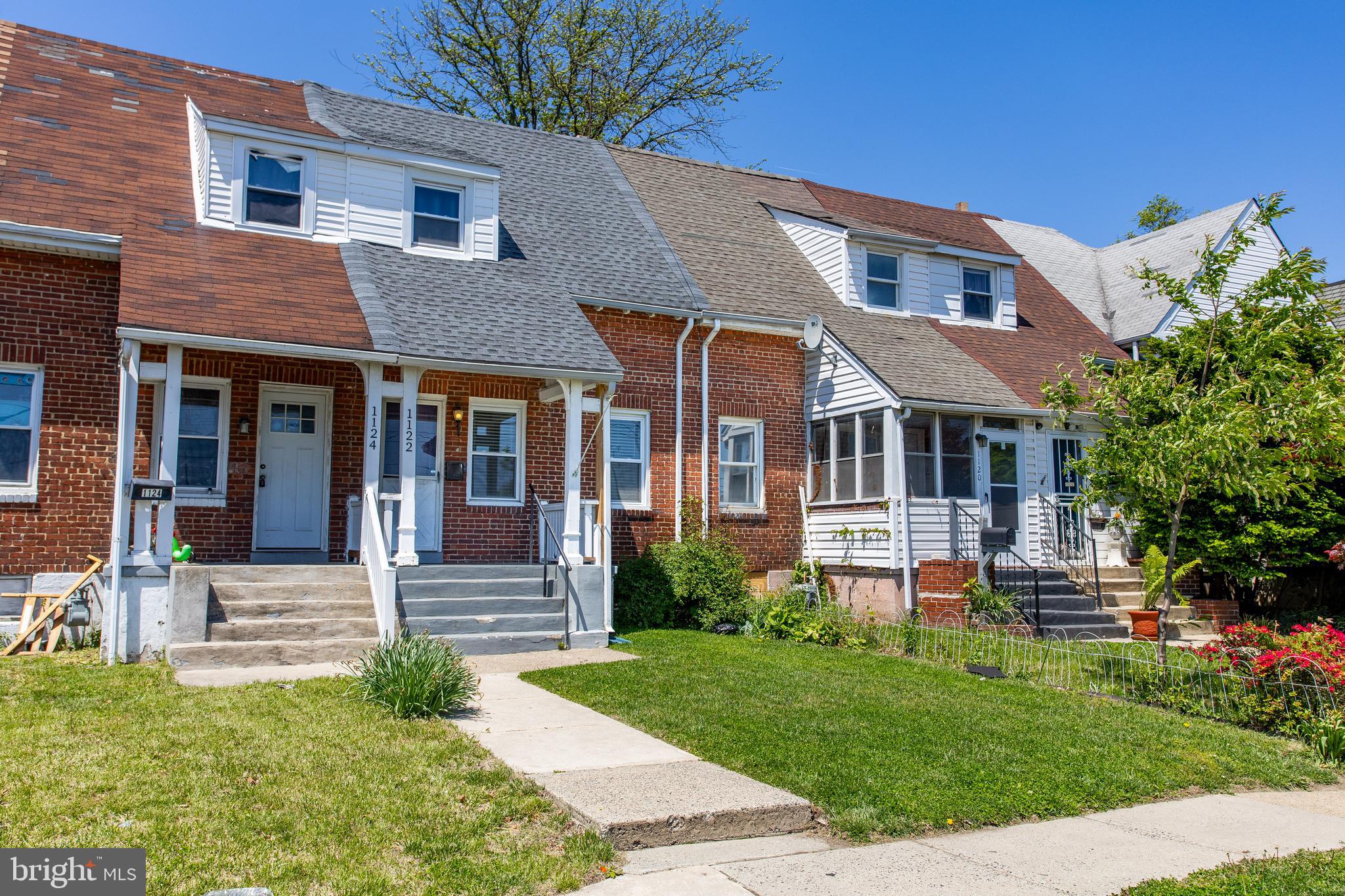 1122 West Ridge Road Marcus Hook, PA 19061 - Photo 2 of 27 a front view of a house with a yard