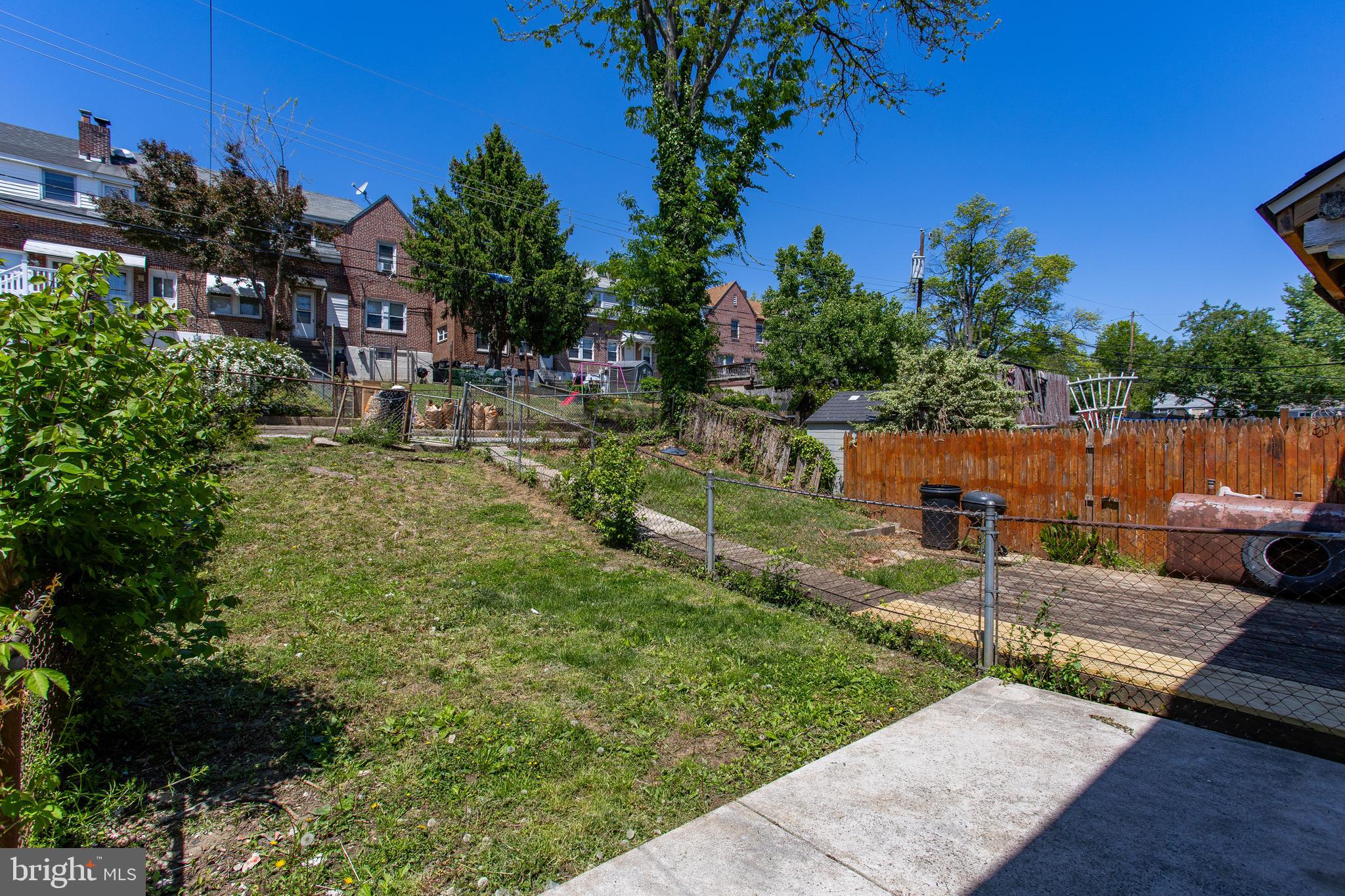 1122 West Ridge Road Marcus Hook, PA 19061 - Photo 24 of 27 a view of a backyard with couches plants and large trees