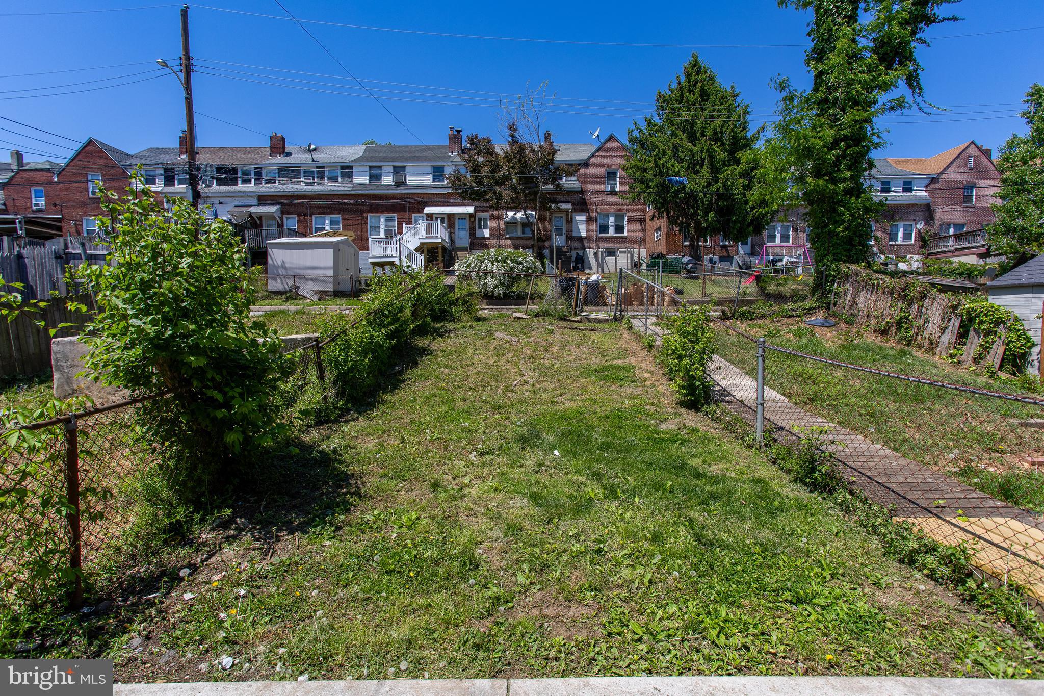 1122 West Ridge Road Marcus Hook, PA 19061 - Photo 25 of 27 a view of a garden with a building in the background