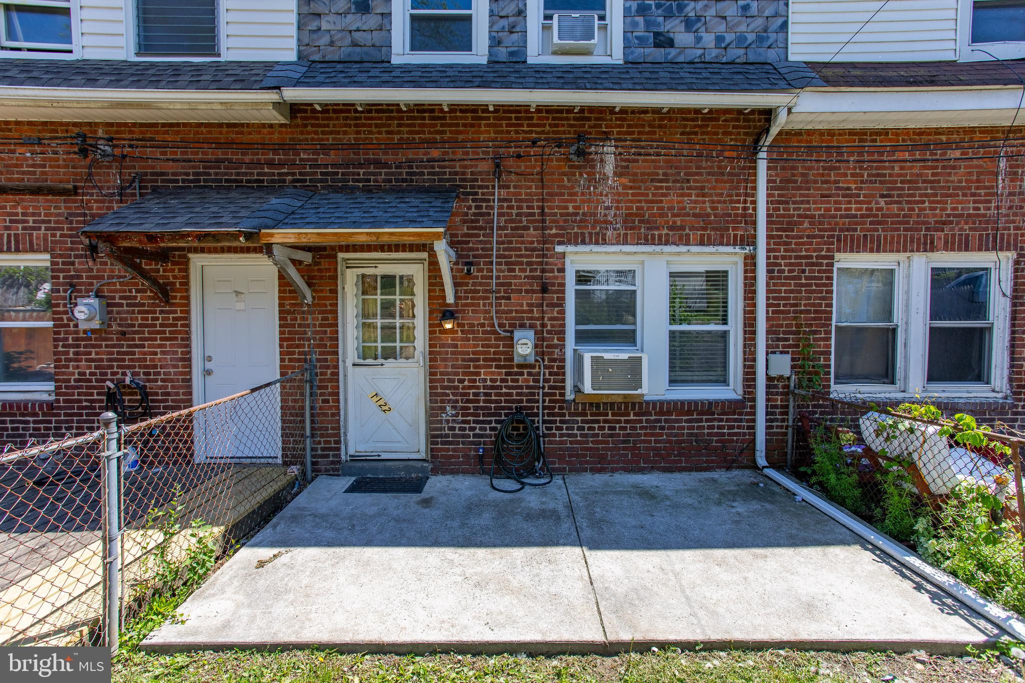 1122 West Ridge Road Marcus Hook, PA 19061 - Photo 26 of 27 a front view of a house with a garden