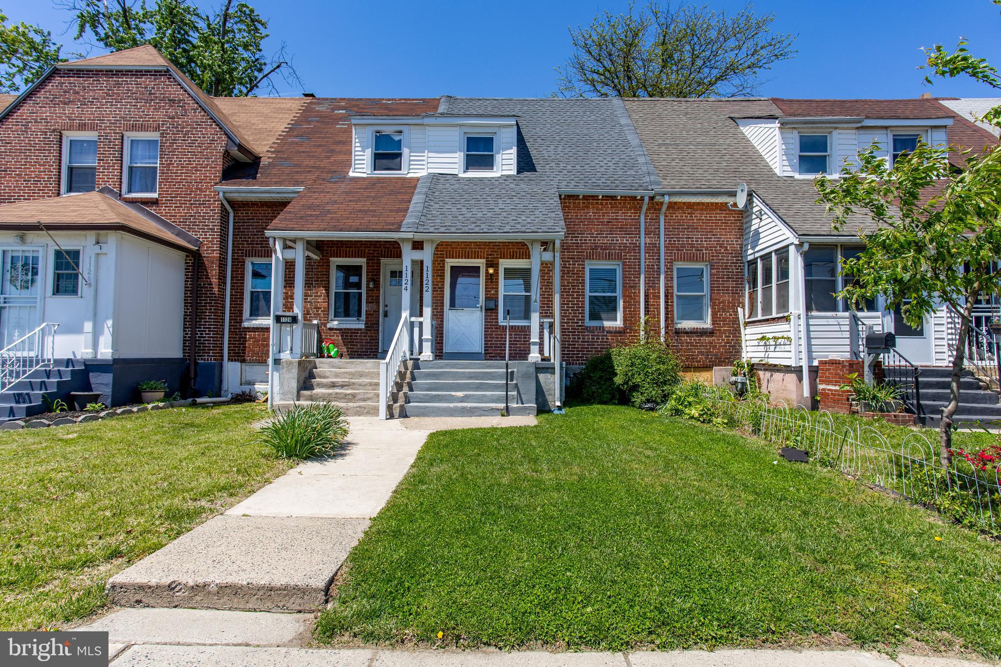 1122 West Ridge Road Marcus Hook, PA 19061 - Photo 4 of 27 a front view of a house with a yard