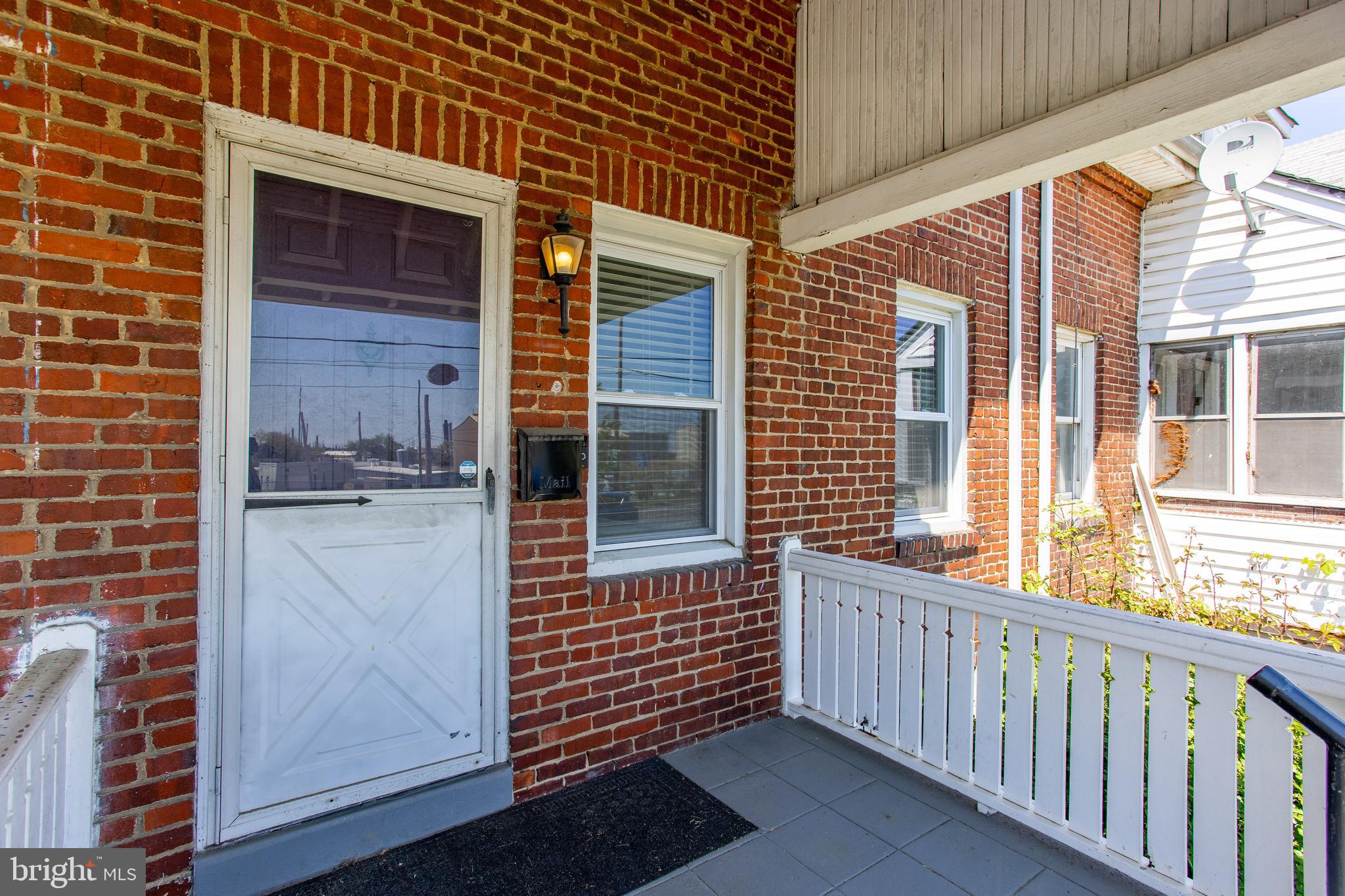 1122 West Ridge Road Marcus Hook, PA 19061 - Photo 5 of 27 a view of a brick house with an outdoor space