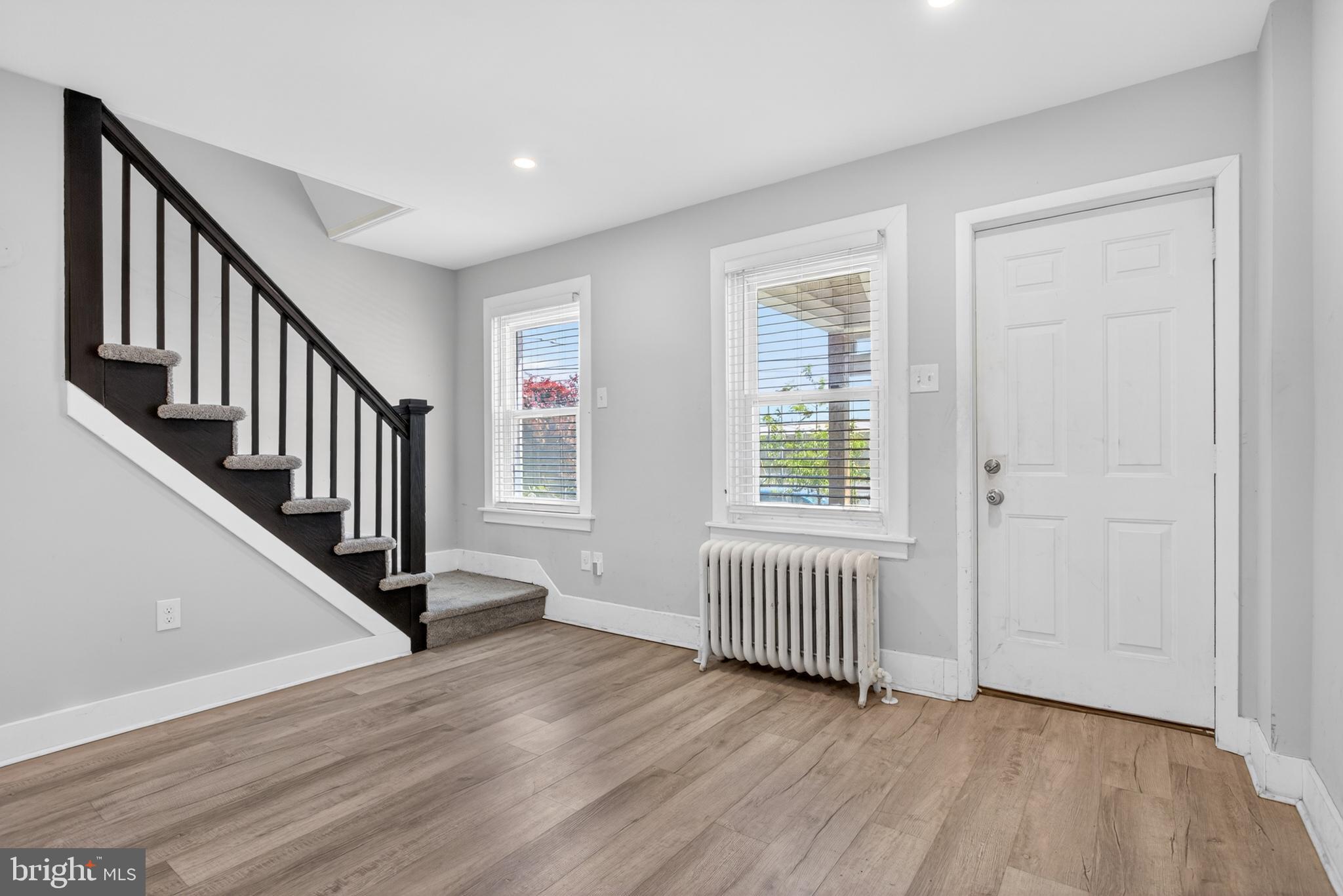 1122 West Ridge Road Marcus Hook, PA 19061 - Photo 6 of 27 a view of an entryway with wooden floor and stairs