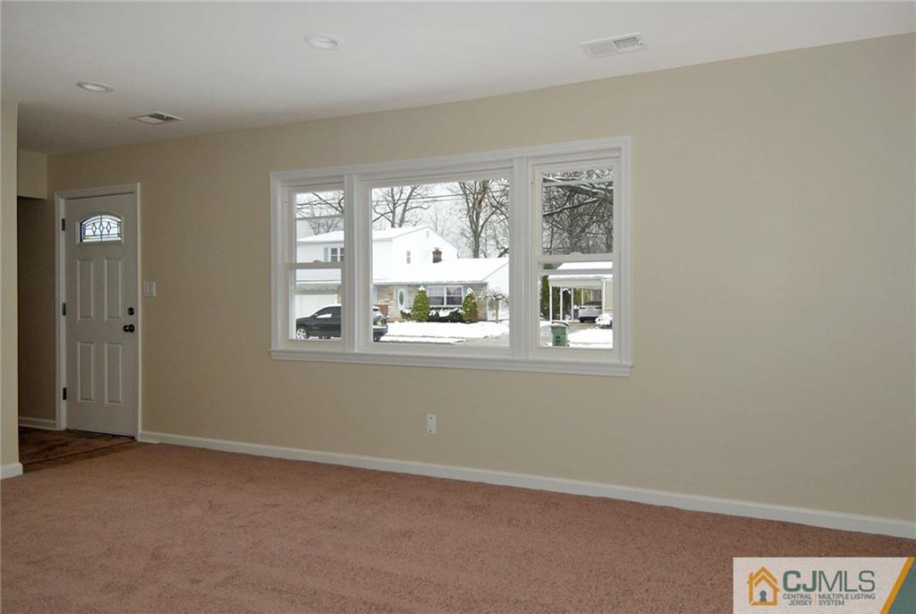 26 Cambridge Road Edison, NJ 08817 - Photo 4 of 17 a view of an empty room with a window