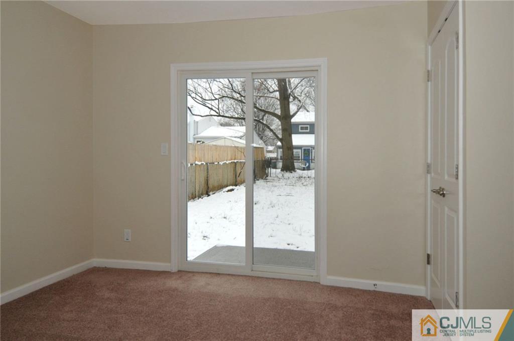 26 Cambridge Road Edison, NJ 08817 - Photo 6 of 17 an empty room with windows