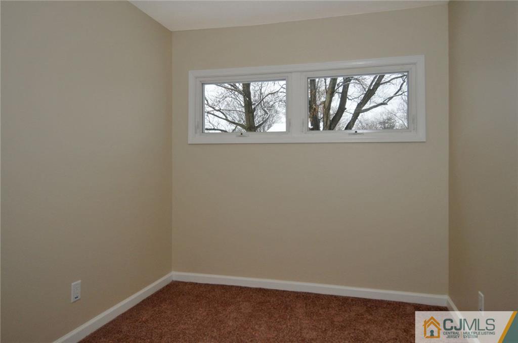 26 Cambridge Road Edison, NJ 08817 - Photo 8 of 17 an empty room with windows