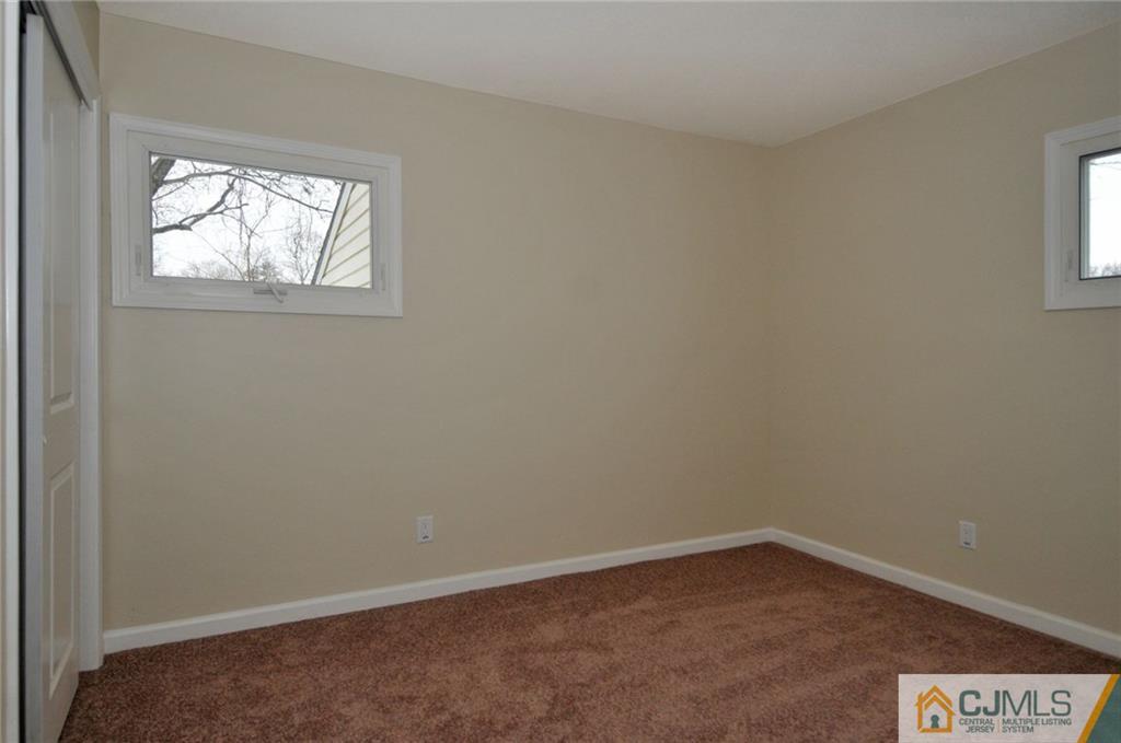 26 Cambridge Road Edison, NJ 08817 - Photo 9 of 17 an empty room with a window