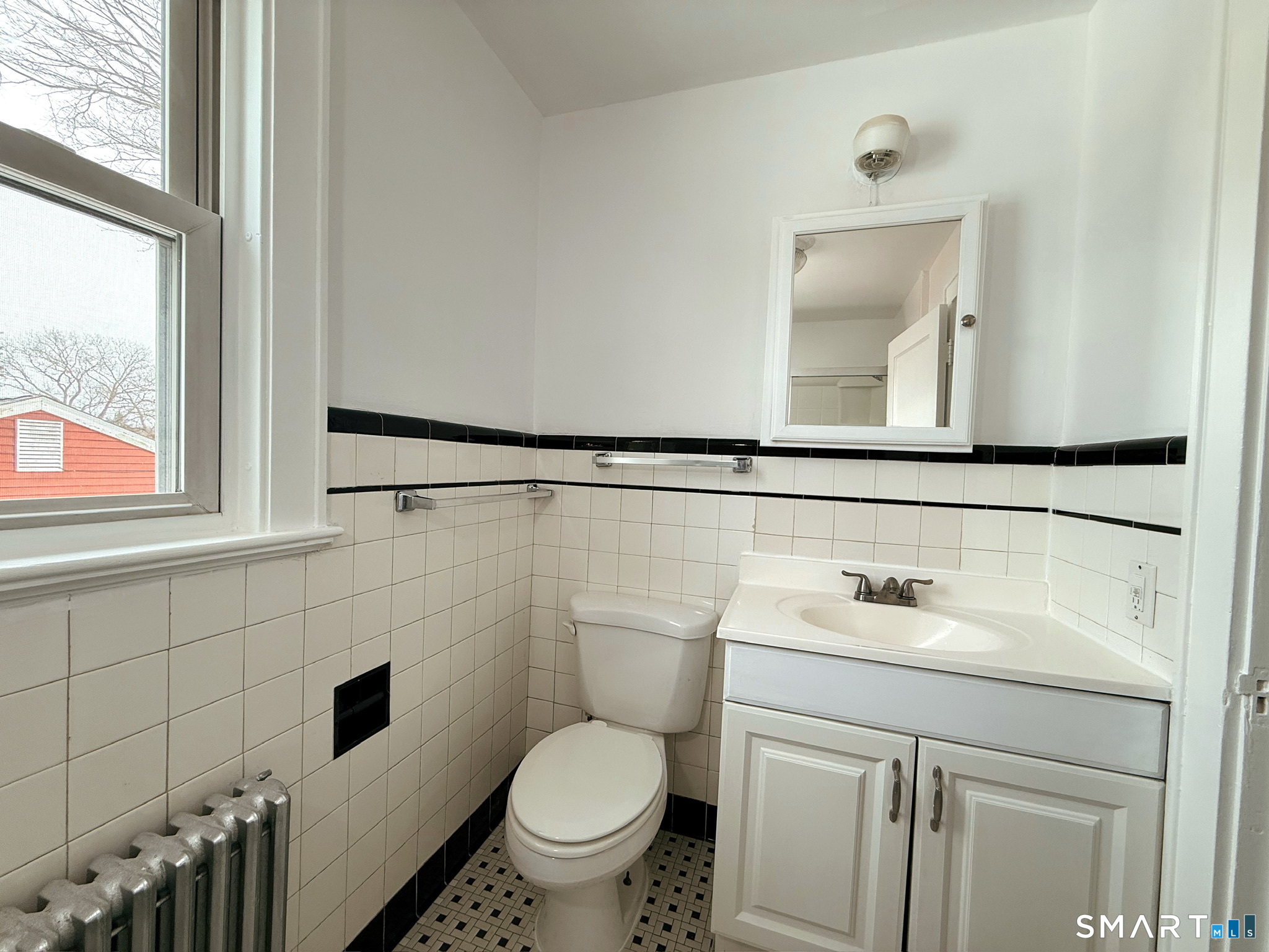 8 Garden Street Naugatuck, CT 06770 - Photo 11 of 14 a bathroom with a sink toilet and mirror