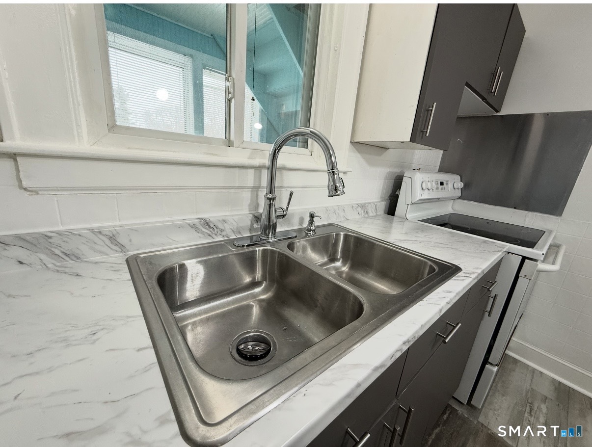 8 Garden Street Naugatuck, CT 06770 - Photo 6 of 14 a close view of sink and tap