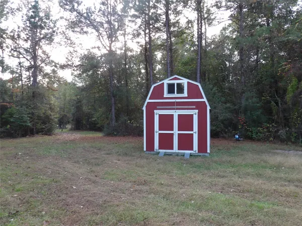 a view of a car park in front of house