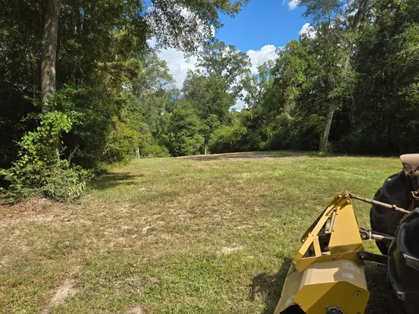 a view of a lake with a yard