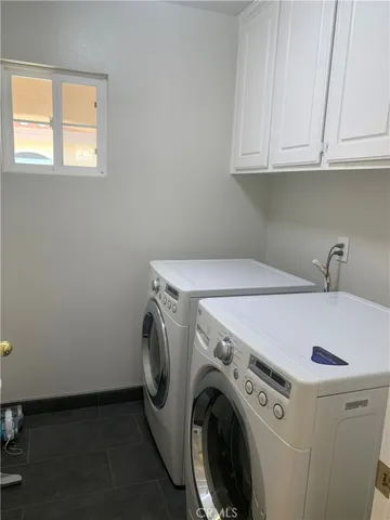 an empty room with wooden floor and closet