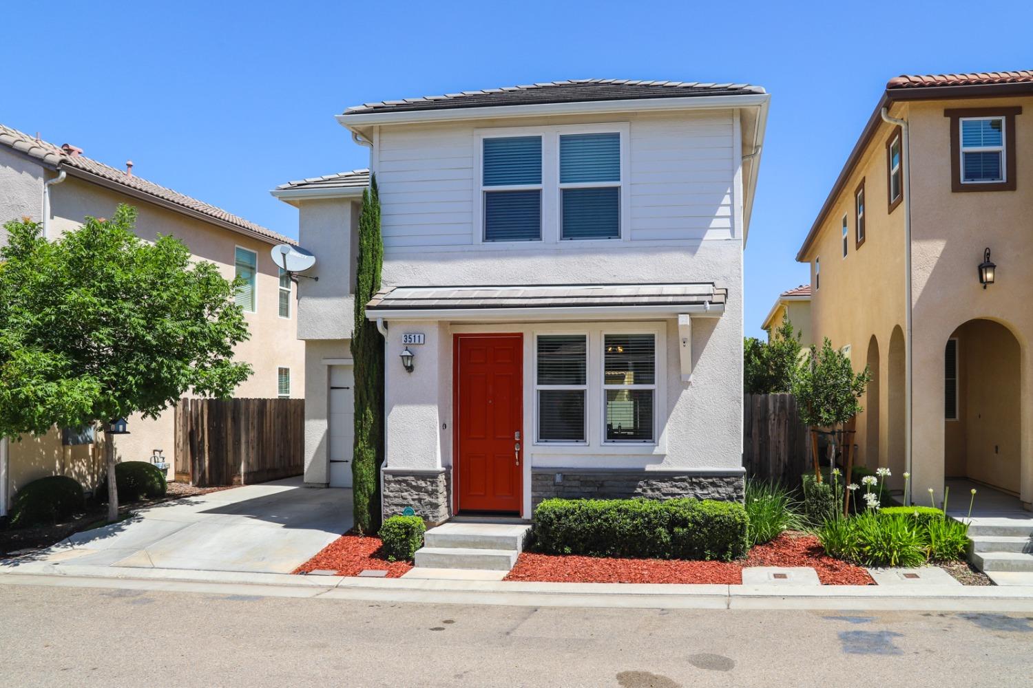 3511 Generosity Way Clovis, CA 93619 - Photo 1 of 26 a front view of a house with yard
