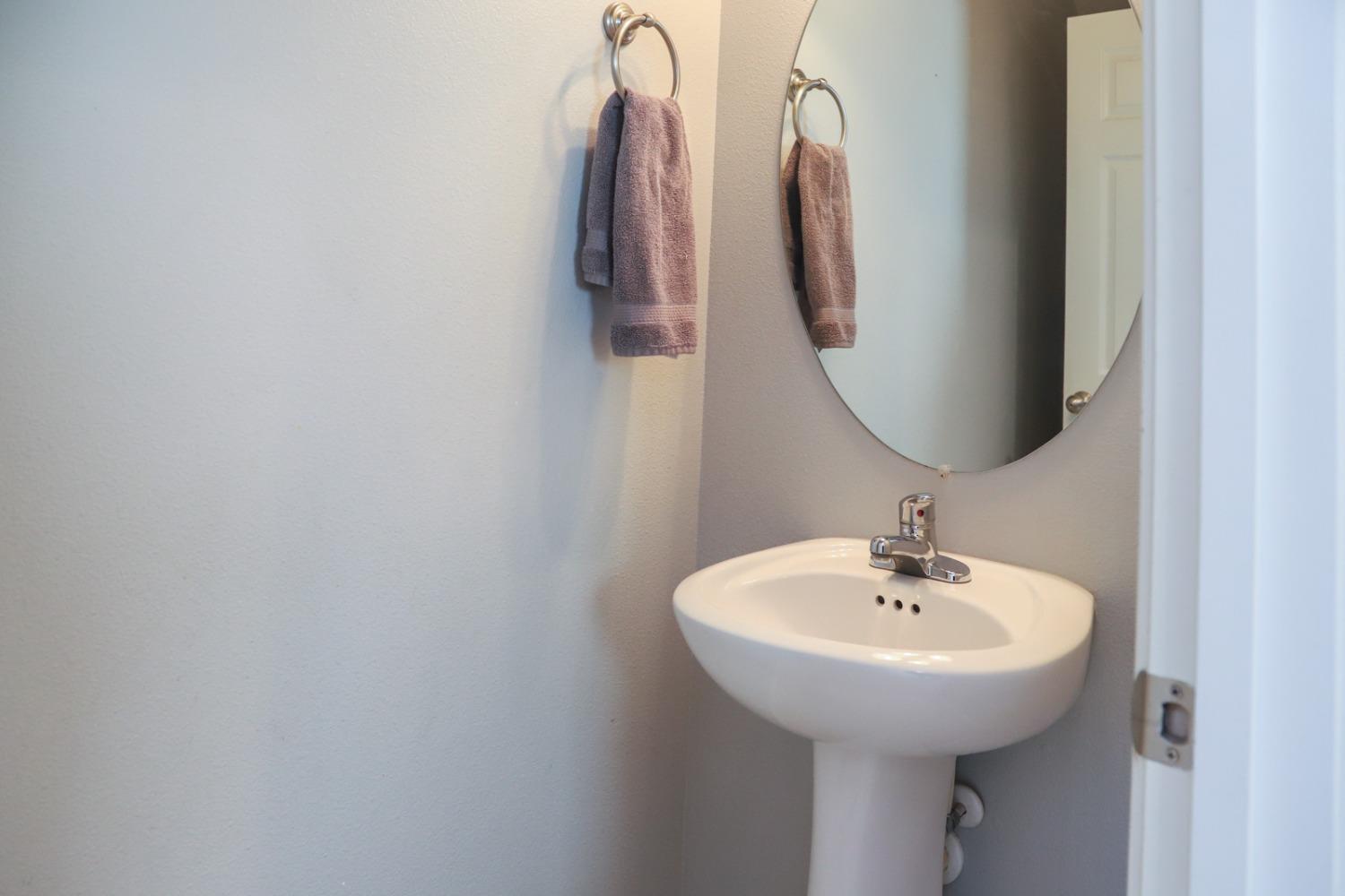 3511 Generosity Way Clovis, CA 93619 - Photo 12 of 26 a bathroom with a sink and a mirror