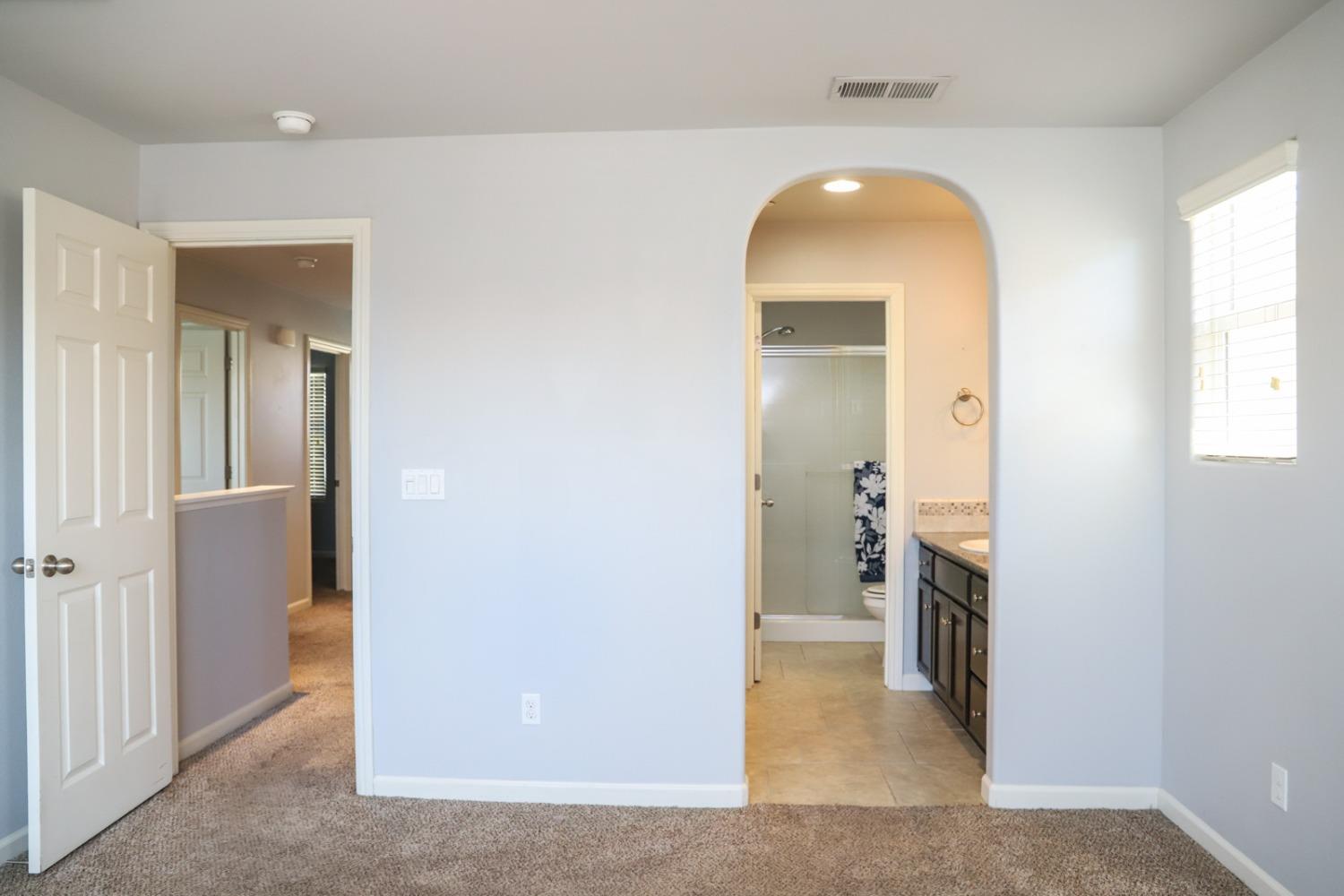 3511 Generosity Way Clovis, CA 93619 - Photo 21 of 26 a view of a hallway with a livingroom and a bathroom
