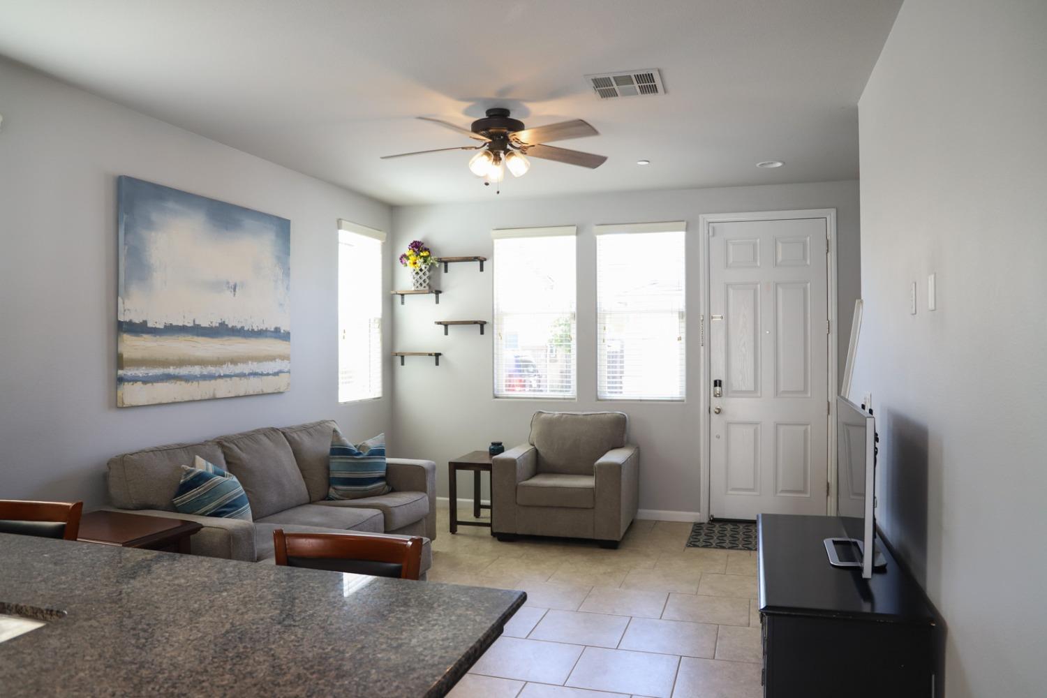 3511 Generosity Way Clovis, CA 93619 - Photo 9 of 26 a living room with furniture and a large window