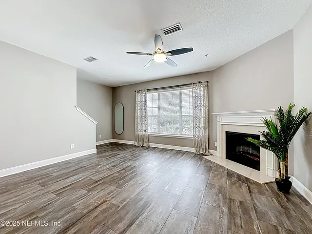 a view of a room with a large window