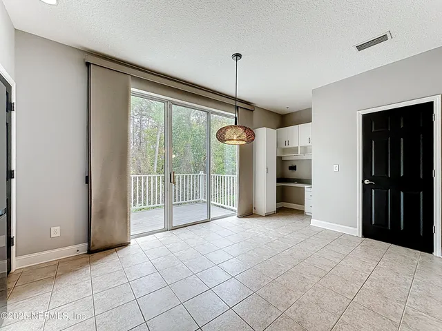 a kitchen with stainless steel appliances granite countertop a sink refrigerator and cabinets