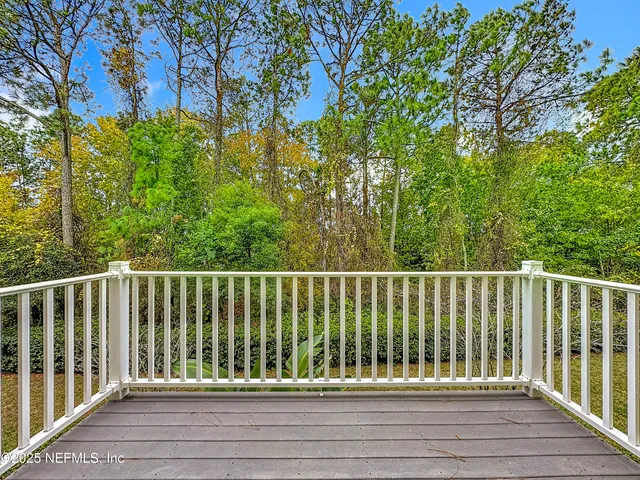 a kitchen with kitchen island granite countertop a stove a sink and a refrigerator
