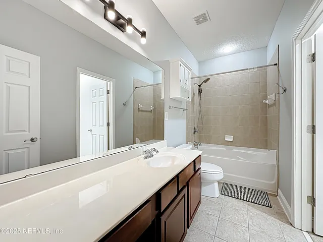 a view of staircase with white walls