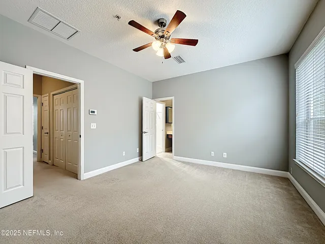 a bathroom with a double vanity sink toilet mirror bathtub and shower