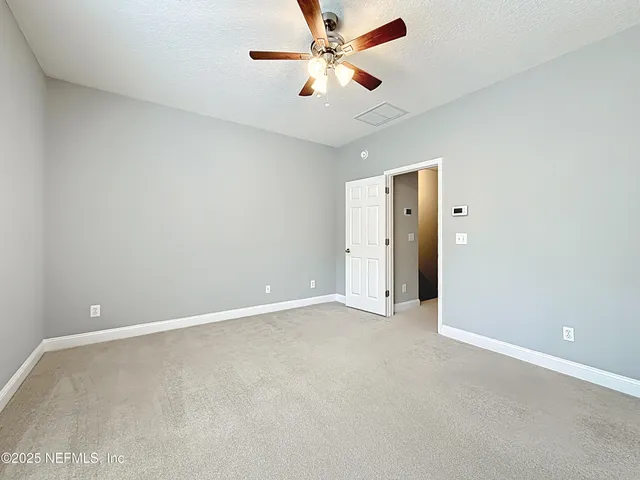 a bathroom with a sink double vanity and a mirror
