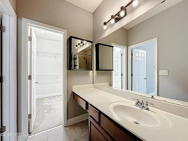 a kitchen with stainless steel appliances kitchen island granite countertop a refrigerator and a stove