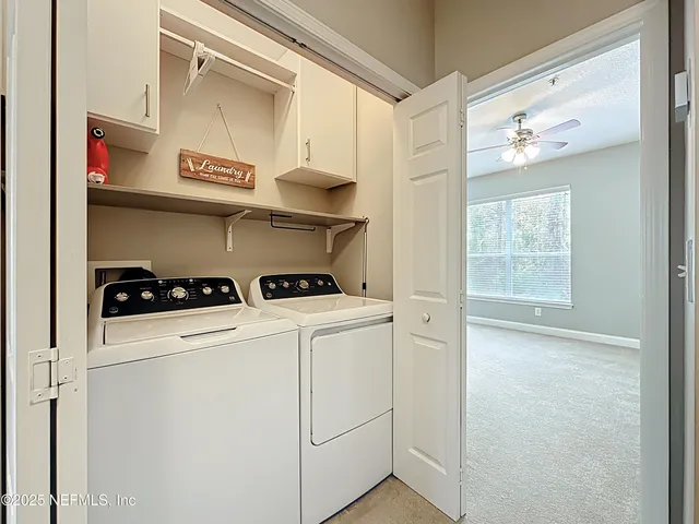 a view of an empty room and a window
