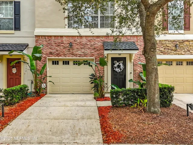 a view of park with large trees