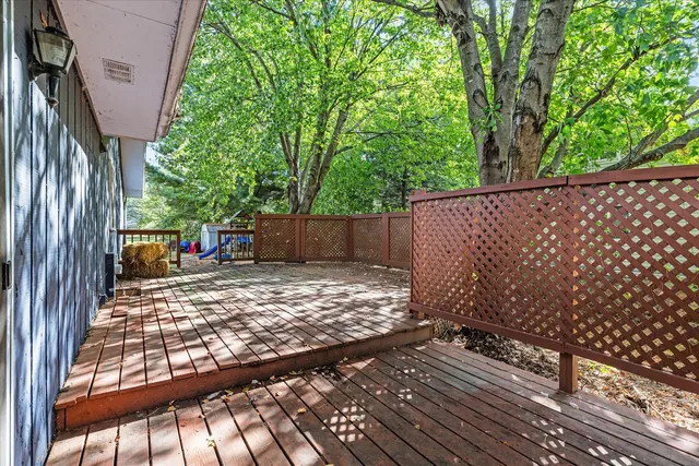 a view of balcony with furniture and wooden deck